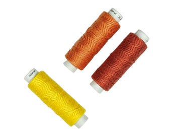 NEW COLORS! Lecien Cosmo Hidamari sashiko thread - Yellow, Orange and Brick hues - 30 meter cone