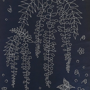 May include: Dark navy fabric featuring a white embroidered floral design. The design includes hanging wisteria, flowers, and butterflies. The embroidery is done with a dotted line stitch.