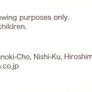 May include: A close-up of a product label with the text "<WARNING> This product should be used for sewing purposes only. Please keep out of reach of small children." and "<MANUFACTURER> Tulip Company Limited 4-19-8, Kusunoki-Cho, Nishi-Ku, Hiroshima 733-0002 JAPAN www.tulip-japan.co.jp". The label also includes information about the materials and size of the product.