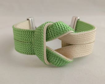 Green and off-white knot bracelet created with a vintage, silk kumihimo obijime tie