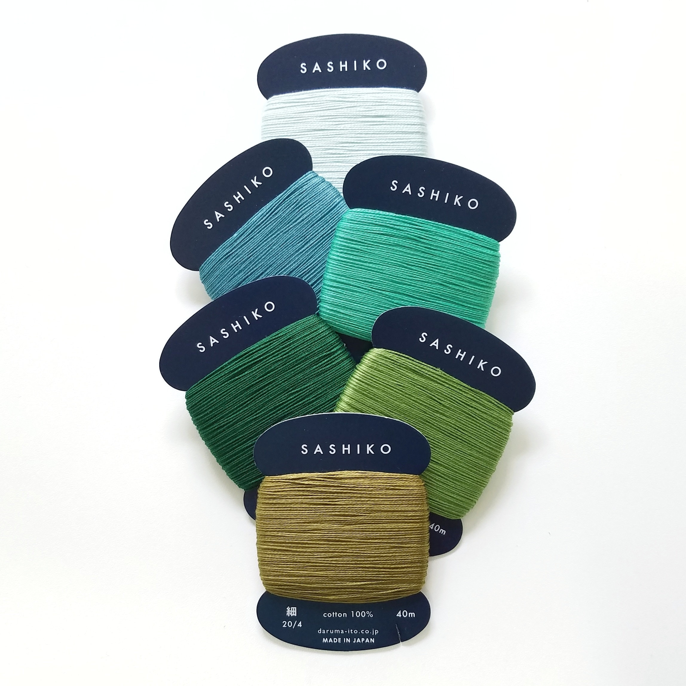 Daruma 20/4 thin sashiko thread - Green hued solid colors - 40 meter skein