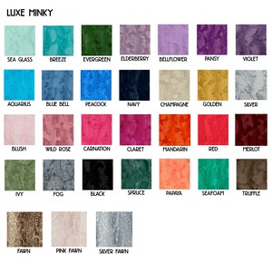 May include: A color chart with 24 different colors of minky fabric. The colors are arranged in rows and columns, and each color has a name printed below it. The colors include Sea Glass, Breeze, Evergreen, Elderberry, Bellflower, Pansy, Violet, Aquarius, Blue Bell, Peacock, Navy, Champagne, Golden, Silver, Blush, Wild Rose, Carnation, Claret, Mandarin, Red, Merlot, Ivy, Fog, Black, Spruce, Papaya, Seafoam, Truffle, Fawn, Pink Fawn, and Silver Fawn.