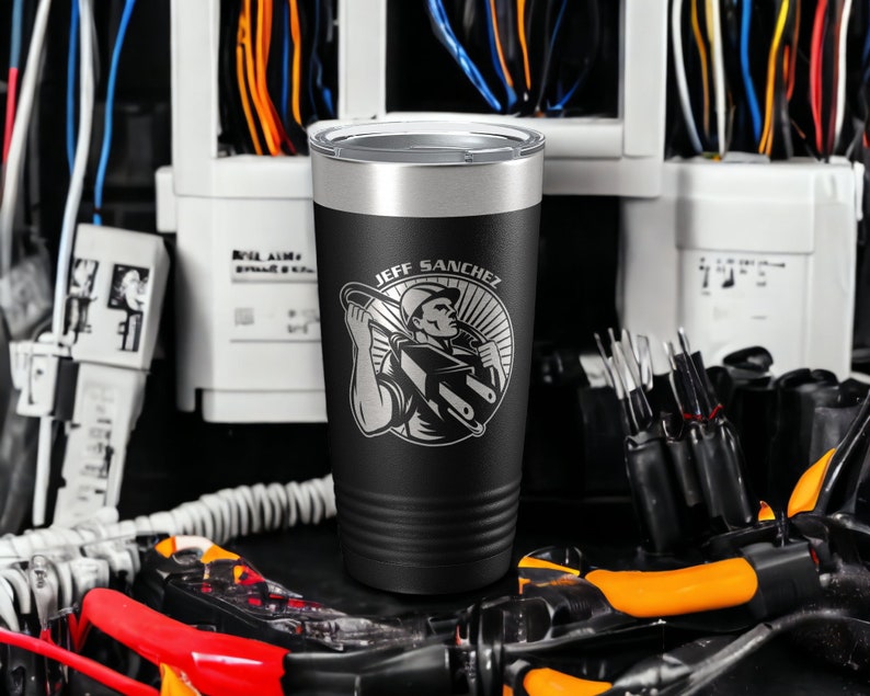 May include: Black and silver stainless steel tumbler with a black and white graphic of an electrician holding a wire and the text "JEFF SANCHEZ".