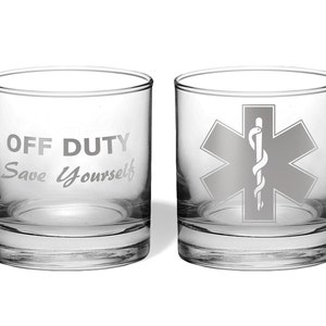 May include: Two clear glass tumblers with a white etched design. One tumbler has the text "OFF DUTY Save Yourself" and the other has a white etched medical symbol.