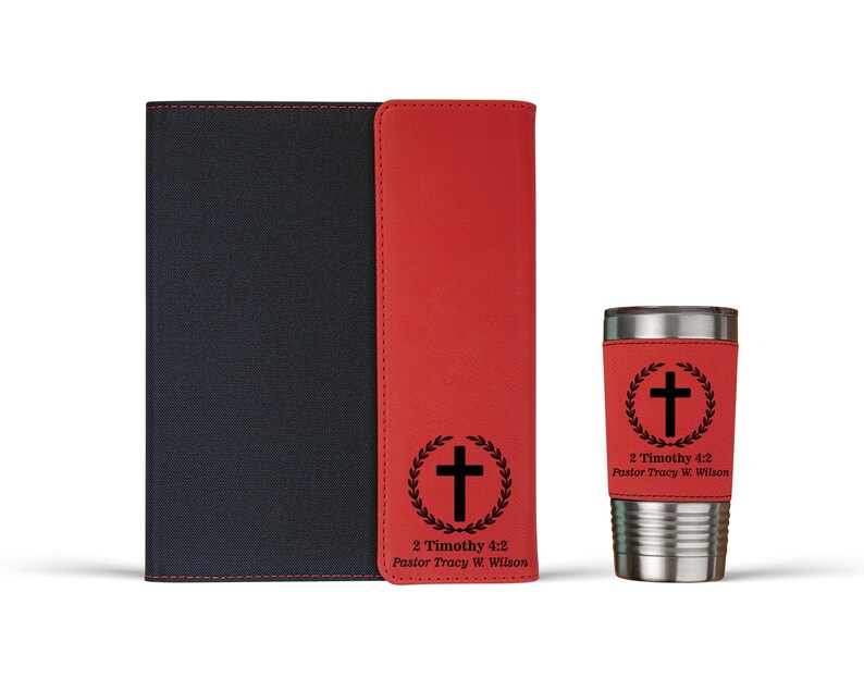 May include: A red and black leather journal with a cross and the text "2 Timothy 4:2 Pastor Tracy W. Wilson" on the front cover. A red and silver travel mug with a cross and the text "2 Timothy 4:2 Pastor Tracy W. Wilson" on the side.