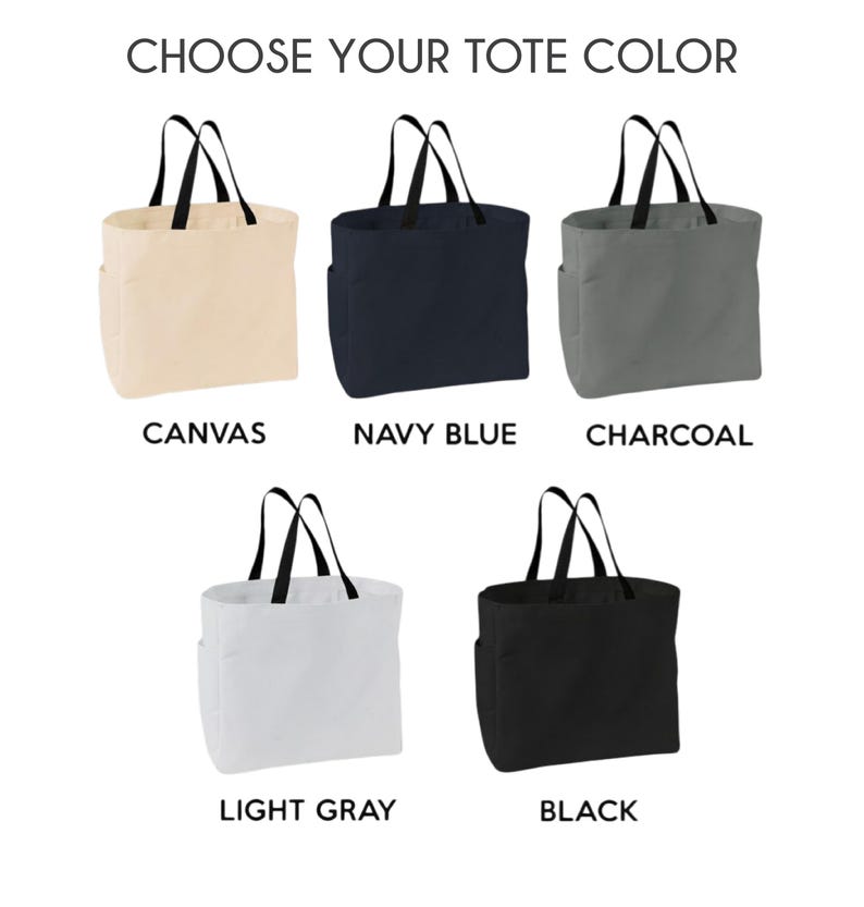 May include: Five tote bags in various colours: canvas, navy blue, charcoal, light grey, and black. Each bag has black handles and a side pocket. The text "CHOOSE YOUR TOTE COLOR" is at the top, with the colour names below each bag.