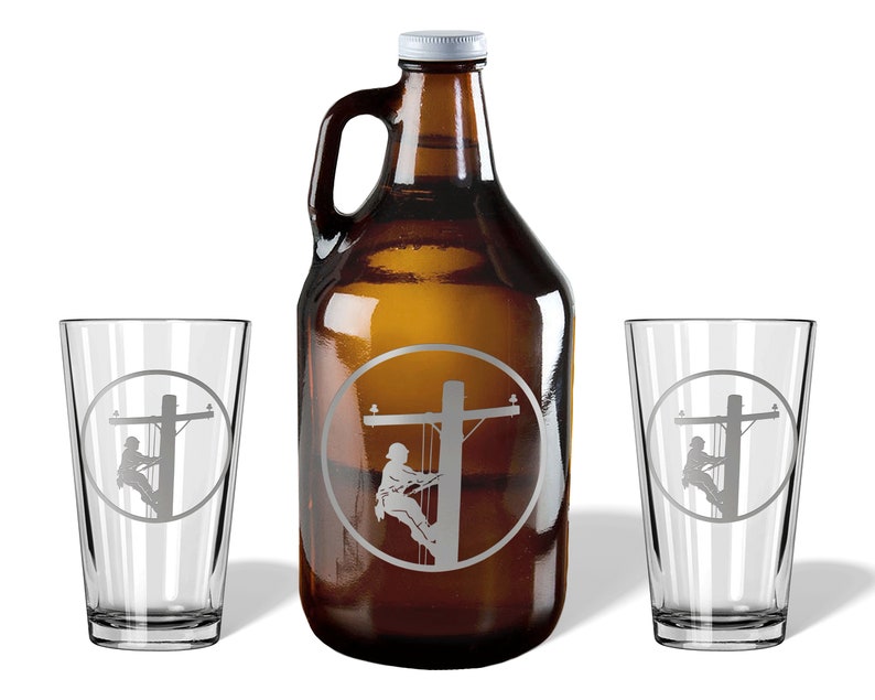 May include: A brown glass growler with a white cap and two clear glass pint glasses. Each item features an etched circular design showing a utility worker climbing a wooden power pole. The set includes one large jug and two matching drinking glasses.