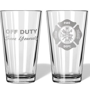May include: Two clear glass pint glasses with etched designs. The glass on the left says "OFF DUTY Save Yourself". The glass on the right has a fire department logo with the words "FIRE DEPT."