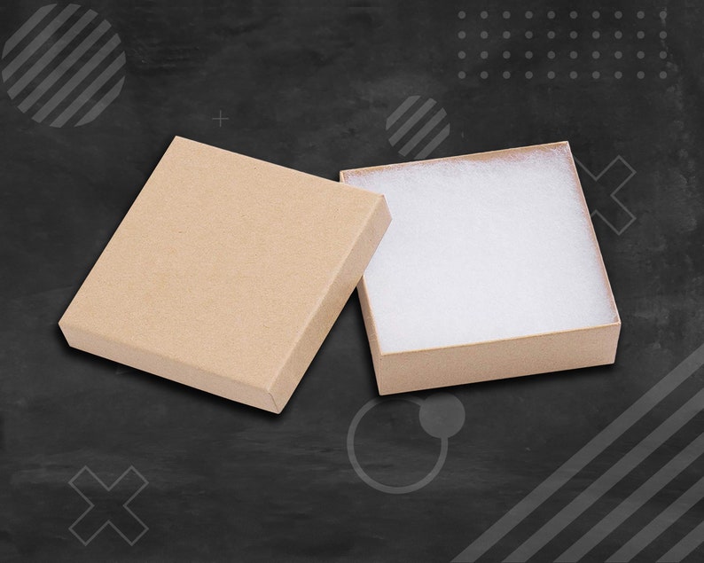 May include: Two open brown cardboard gift boxes with white tissue paper lining. The boxes are on a black background.