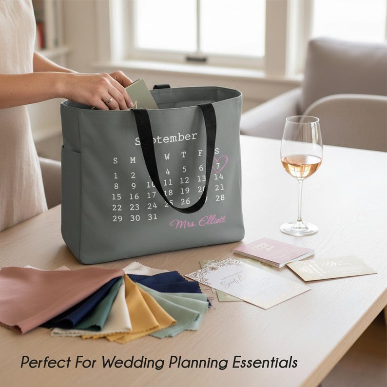 May include: A white ceramic mug with a black handle and the text "But First, Coffee" in a black, handwritten-style font. The mug is on a white surface.