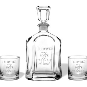 May include: A clear glass decanter with a matching stopper and two matching lowball glasses. Each piece is etched with the text I SURVIVED my SON'S wedding and the date 10.14.2025. The decanter features a square base and a faceted glass stopper.