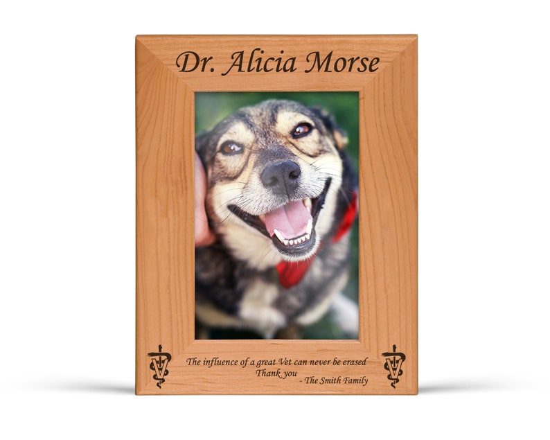 May include: A wooden picture frame with a personalised inscription for Dr. Alicia Morse. The frame features a photo of a dog and the text "The influence of a great Vet can never be erased. Thank you - The Smith Family."