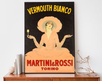 May include: Vintage Martini & Rossi Vermouth Bianco advertisement featuring a woman in a pink dress and hat holding a glass of vermouth. The text "Vermouth Bianco" is in yellow letters on a black background, and the text "Martini & Rossi Torino" is in red letters on a white background.