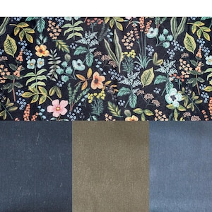 May include: A fabric swatch featuring a floral pattern with pink, yellow, and blue flowers on a black background. Below are three solid fabric swatches in navy blue, olive green, and slate blue.