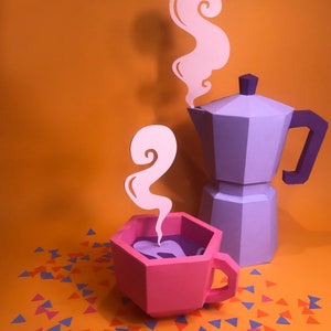May include: A purple coffee pot with a pink coffee cup and steam coming out of both. The coffee pot and cup are made of paper and are sitting on a orange background with confetti.