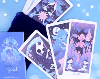 May include: A blue velvet bag with a deck of tarot cards featuring colorful illustrations of various characters. The cards are spread out on a light blue background with white stars. The bag is labeled "CARDDECK! Tarot by me! www.pickchicklymer.com".