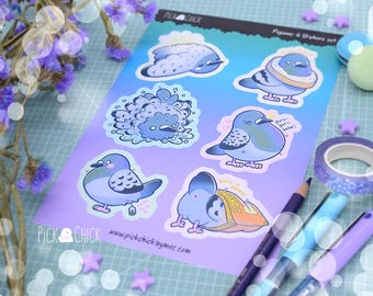 May include: A set of six stickers featuring cute cartoon pigeons in various poses. The stickers are printed on white paper with a rainbow gradient background. The stickers feature phrases like "Gotta go, gotta fly!" and "Golden, crispy, cheesy!"