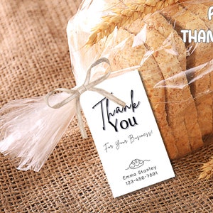 May include: Printable sourdough bread thank you tag with wheat stalks. The tag is white with black text that reads "Thank You For Your Business!" and includes a business name and phone number.