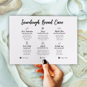 May include: A white card with black text outlining how to store sourdough bread. The card has four sections with headings: Room Temperature, Freezer, Refresh Slices, and Re-Bake Loaf. The card also includes icons for Facebook, a website, and Instagram.