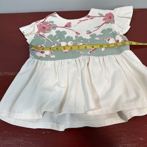 Handmade reimagined vintage tablecloth and thrifted fabric little girls sundress.