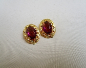 Old, oval ear clips with glass stone