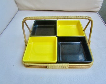 May include: A woven bamboo serving tray with four removable ceramic dishes. Two dishes are yellow and two are black.