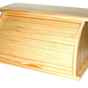 May include: A natural wood bread box with a roll-top lid. The lid is made of horizontal slats that slide up and down.