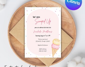 May include: A bridal shower invitation with the text "She's Been Scooped Up" in pink script. The invitation includes event details and a watercolor ice cream cone illustration. The design is set on a wooden plate with an envelope.