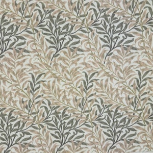 May include: A repeating pattern of stylized leaves and branches in shades of grey, beige, and olive green. The design is set against a white background, creating a textured, natural aesthetic. Suitable for fabric or wallpaper.