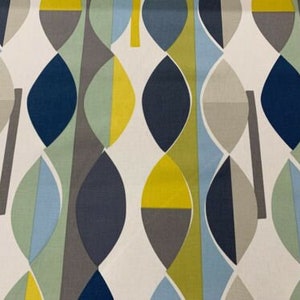 May include: Fabric with a repeating abstract pattern of leaf-like shapes in navy blue, yellow, grey, light blue, and white. The design has a modern, geometric style. The fabric would be suitable for upholstery or soft furnishings.