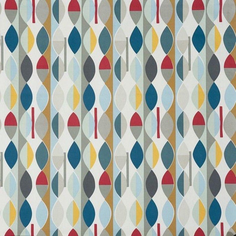 May include: A fabric design featuring a repeating pattern of abstract shapes in blue, yellow, red, grey, and white. The design includes vertical stripes with elongated oval shapes and short red lines. The overall aesthetic is modern and geometric, suitable for textiles or wallpaper.