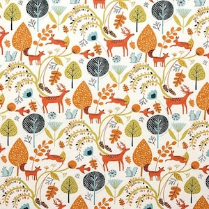 May include: A repeating pattern with a woodland theme. It features orange deer, foxes, and birds amongst trees with orange, yellow, and black leaves. Blue flowers and white squirrels are also present on a cream background.