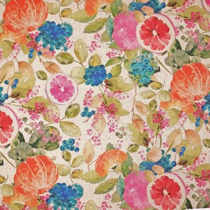 May include: A vibrant floral pattern with watercolour illustrations of citrus fruits, including oranges, grapefruits, and tangerines, alongside blue hydrangeas, berries, and green leaves. The design is set against a neutral, off-white background.