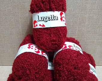 May include: Five balls of red yarn with the label "Lunetta 3" on the top ball.