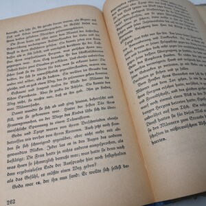 May include: Open book with yellowed pages and black text. The book is open to a page with the number 262 printed at the bottom of the page. The text on the page is in German.