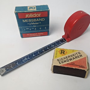 old tape measure / metal bench with plastic housing / 200 cm measure / old tool / 2 m / GDR