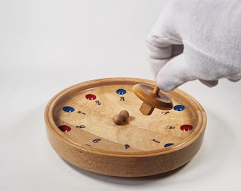 Stara zabawka: tyrolska ruletka, ruletka farmerska / niemiecka ruletka / bączek, drewniana płyta, 2 kulki