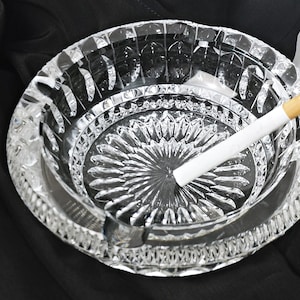 heavy ashtray made of pressed glass / glass ashtray