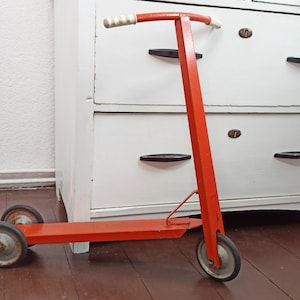 Vintage scooter / old red metal scooter / nostalgic tin scooter / tin toy