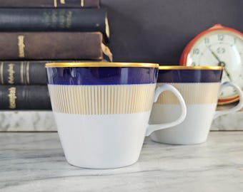 2 coffee or tea cups with cobalt blue and gold rim / antique cups / light porcelain