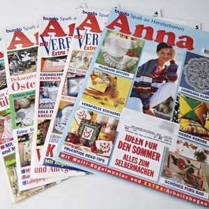 May include: A stack of five Burda Anna magazines featuring various craft projects, including crocheted doilies, embroidery, and knitting. The cover of the top magazine features a woman wearing a colorful striped sweater and a white doily.