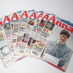 May include: A stack of eight colorful magazines with the word "Anna" on the cover. The magazines are about crafts and feature various knitting and crocheting projects.