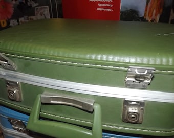 Vintage green small luggage with original creme interior