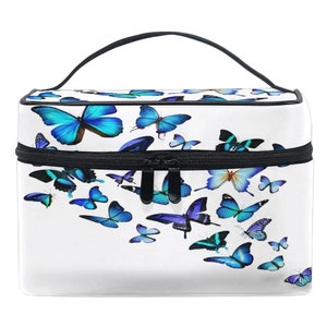 May include: White makeup bag with a black zipper and handle. The bag is decorated with a pattern of blue butterflies.