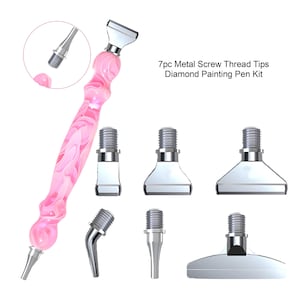 May include: A pink and white marbled diamond painting pen with seven interchangeable metal screw thread tips. The tips include a pointed tip, a flat tip, and a rounded tip.