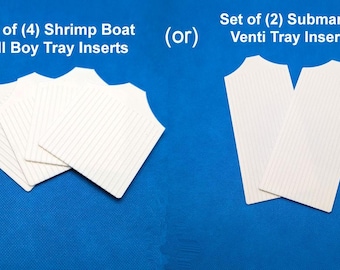 May include: Two sets of white plastic tray inserts. The set on the left is labelled "Set of (4) Shrimp Boat Tall Boy Tray Inserts". The set on the right is labelled "Set of (2) Submarine Venti Tray Inserts".