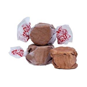 May include: Three chocolate-flavored candy pieces wrapped in white paper with red lettering. The candy is in the shape of a ball and is wrapped in a twist.
