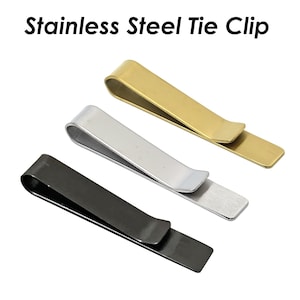 May include: Three stainless steel tie clips in gold, silver, and black.