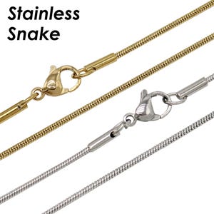 May include: Two gold and one silver snake chains with clasps. Stainless Snake.