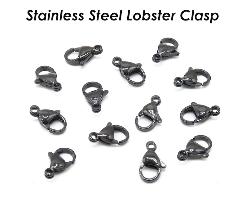 May include: A close-up of 12 black stainless steel lobster clasps. The clasps are small and have a shiny finish.